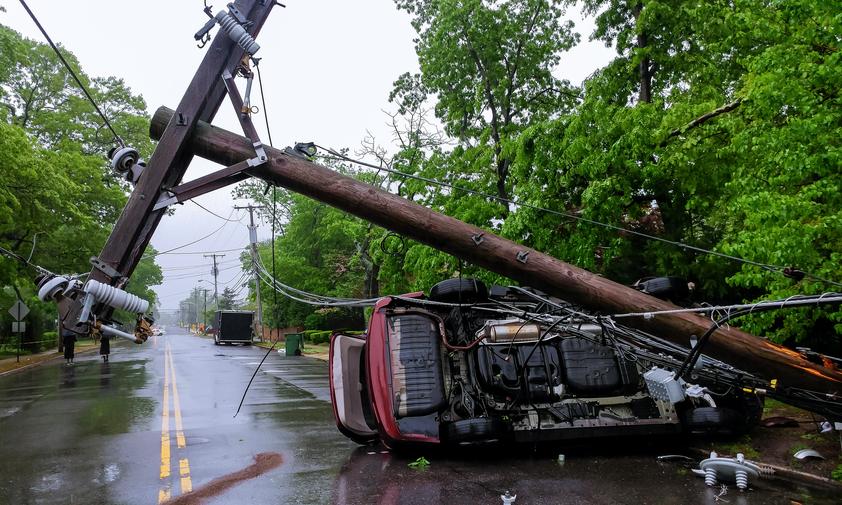 Overturned Car and Fallen Electrical Pole from Storm